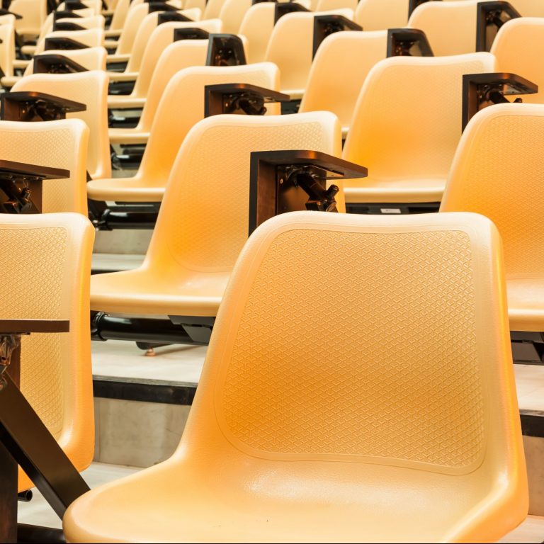 rows of yellow plastic chairs